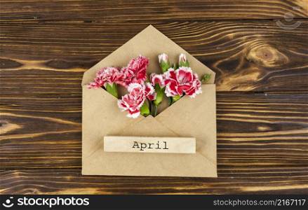 april text envelope with red flowers table