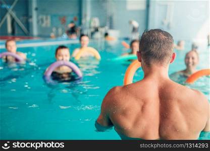 Aqua aerobics, healthy water sport, indoor swimming pool, recreational leisure. Aqua aerobics, healthy water sport