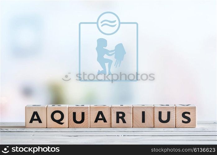 Aquarius star sign on a wooden table