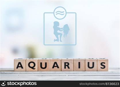 Aquarius star sign on a wooden table