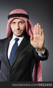 Arab businessman againt grey background