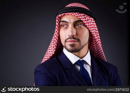 Arab businessman in dark studio