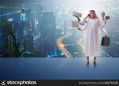 Arab businessman in multitasking concept