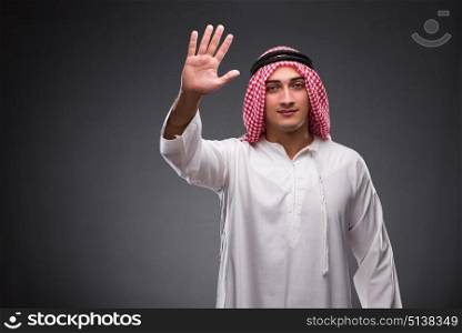 Arab businessman on gray background