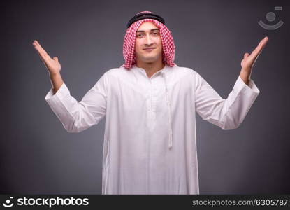 Arab businessman on gray background