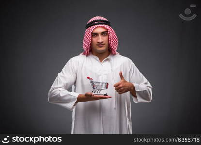 Arab businessman on gray background