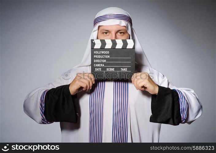 Arab businessman with movie board