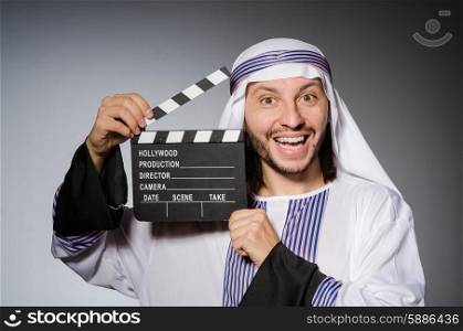 Arab businessman with movie board