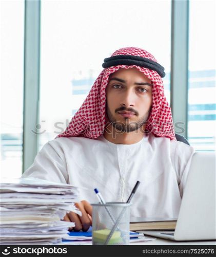 Arab businessman working in the office. The arab businessman working in the office