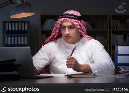 Arab businessman working late in office