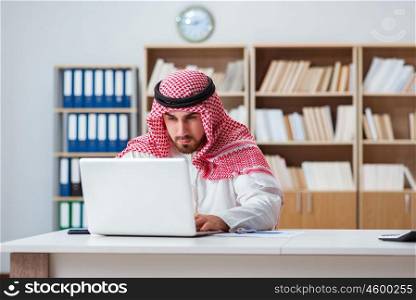 Arab businessman working on computer