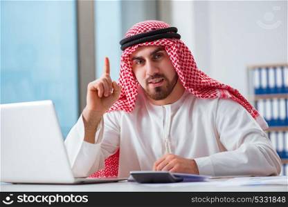 Arab businessman working on laptop computer