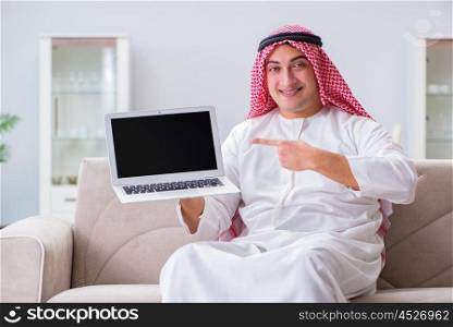 Arab businessman working sitting at couch