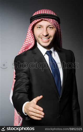 Arab businesssman against grey background
