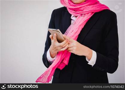 Arab businesswoman messaging on a mobile phone