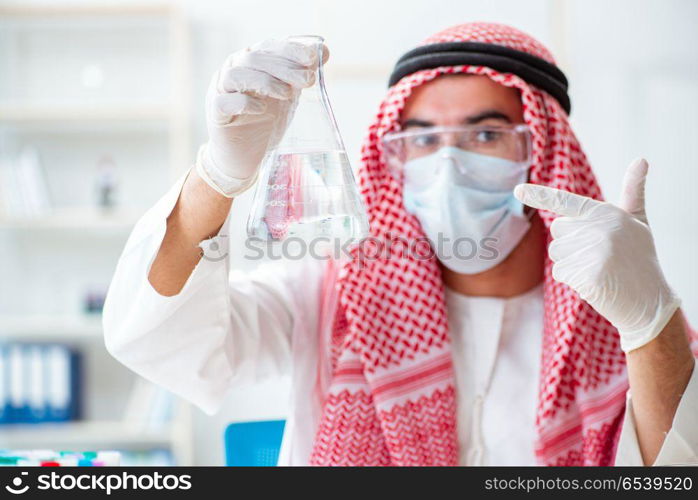 Arab chemist checking the quality of drinking water