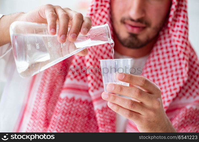 Arab chemist checking the quality of drinking water