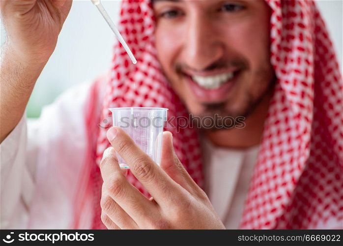 Arab chemist checking the quality of drinking water