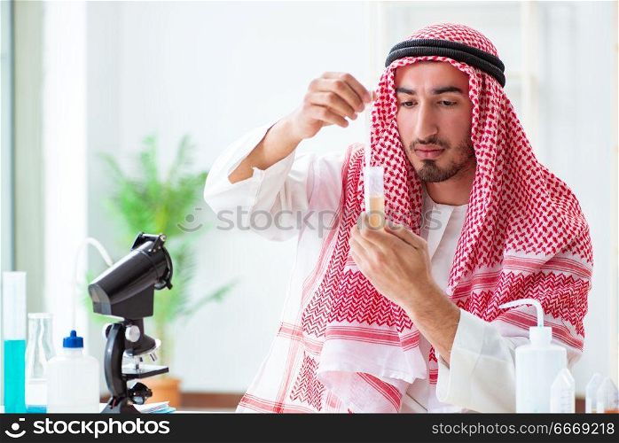 Arab chemist checking the quality of drinking water