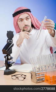 Arab chemist working in lab