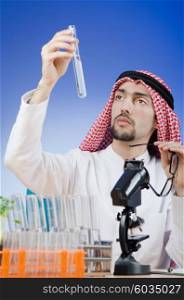 Arab chemist working in lab