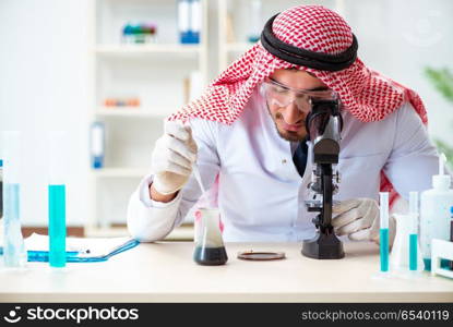 Arab chemist working in the lab office