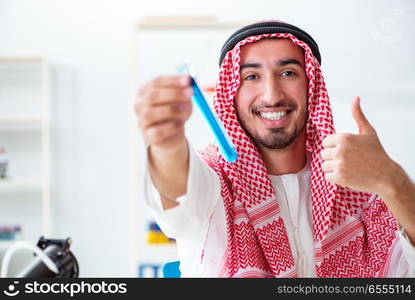 Arab chemist working in the lab office