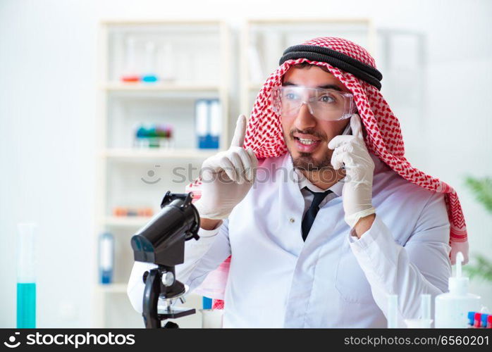 Arab chemist working in the lab office