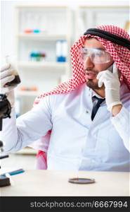 Arab chemist working in the lab office