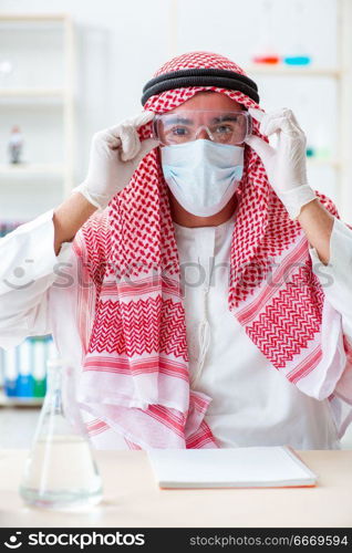 Arab chemist working in the lab office