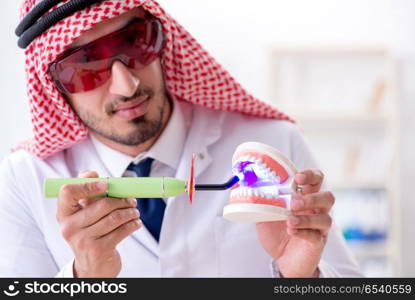 Arab dentist working on new teeth implant