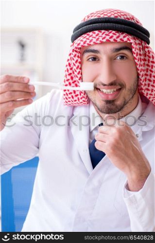 Arab dentist working on new teeth implant