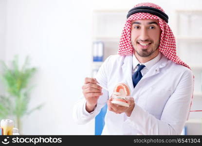 Arab dentist working on new teeth implant