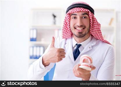 Arab dentist working on new teeth implant