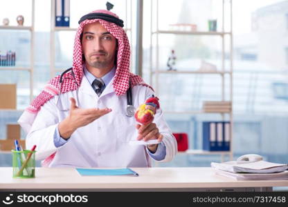 Arab doctor cardiologist working in the clinic 
