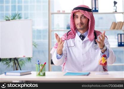 Arab doctor cardiologist working in the clinic 