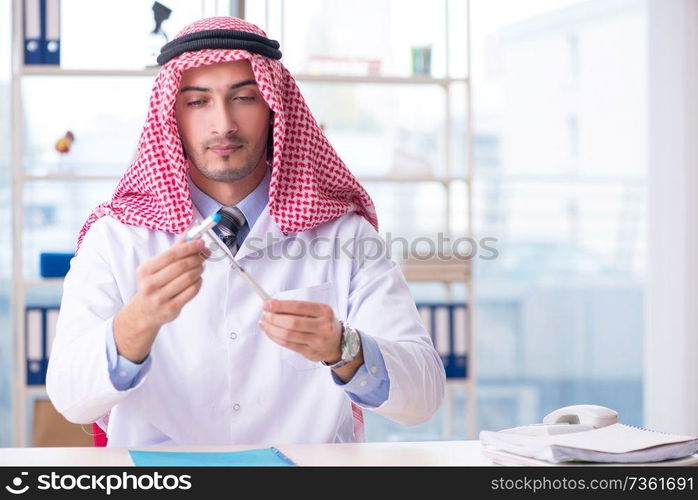 Arab doctor neurologist working in the clinic