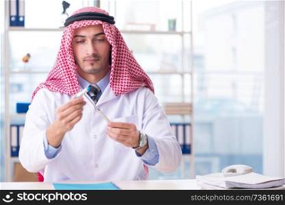 Arab doctor neurologist working in the clinic