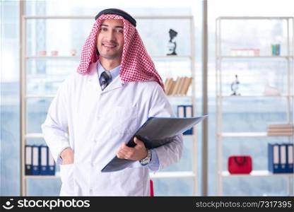 Arab doctor radiologist working in the clinic . Arab doctor radiologist working in the clinic