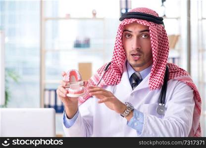 Arab doctor stomatologist working in the clinic