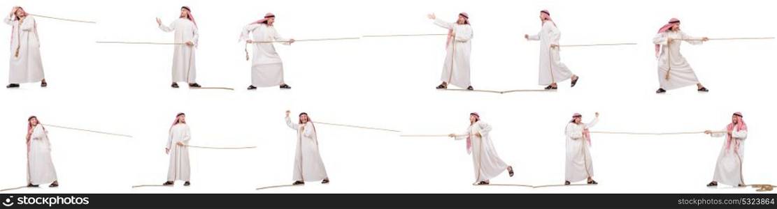 Arab in tug of war concept on white