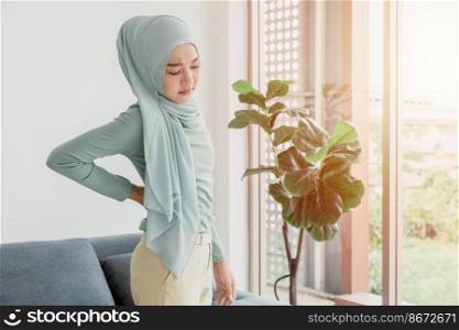Arab Islam Women back pain from office working or Kidney disease health problem expression.
