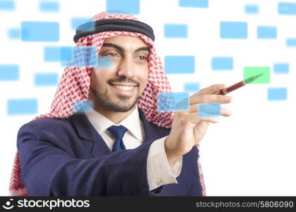 Arab man pressing virtual buttons