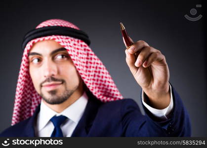 Arab man pressing virtual buttons