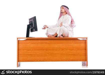 Arab man sitting at his desk