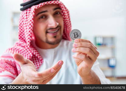 Arab man with bitcoin in cryptocurrency mining concept