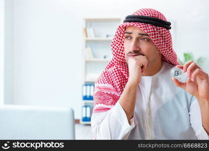 Arab man with bitcoin in cryptocurrency mining concept