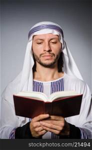 Arab man with book in diversity concept