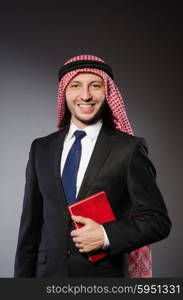 Arab man with book in diversity concept