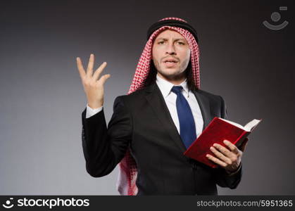 Arab man with book in diversity concept